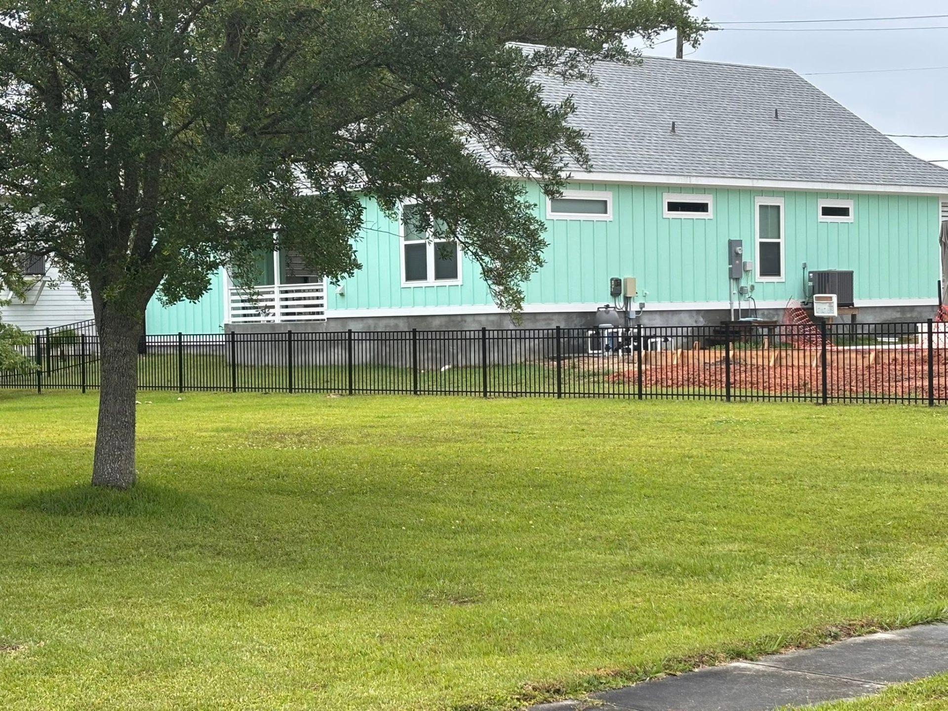 Black aluminum fence residential yard